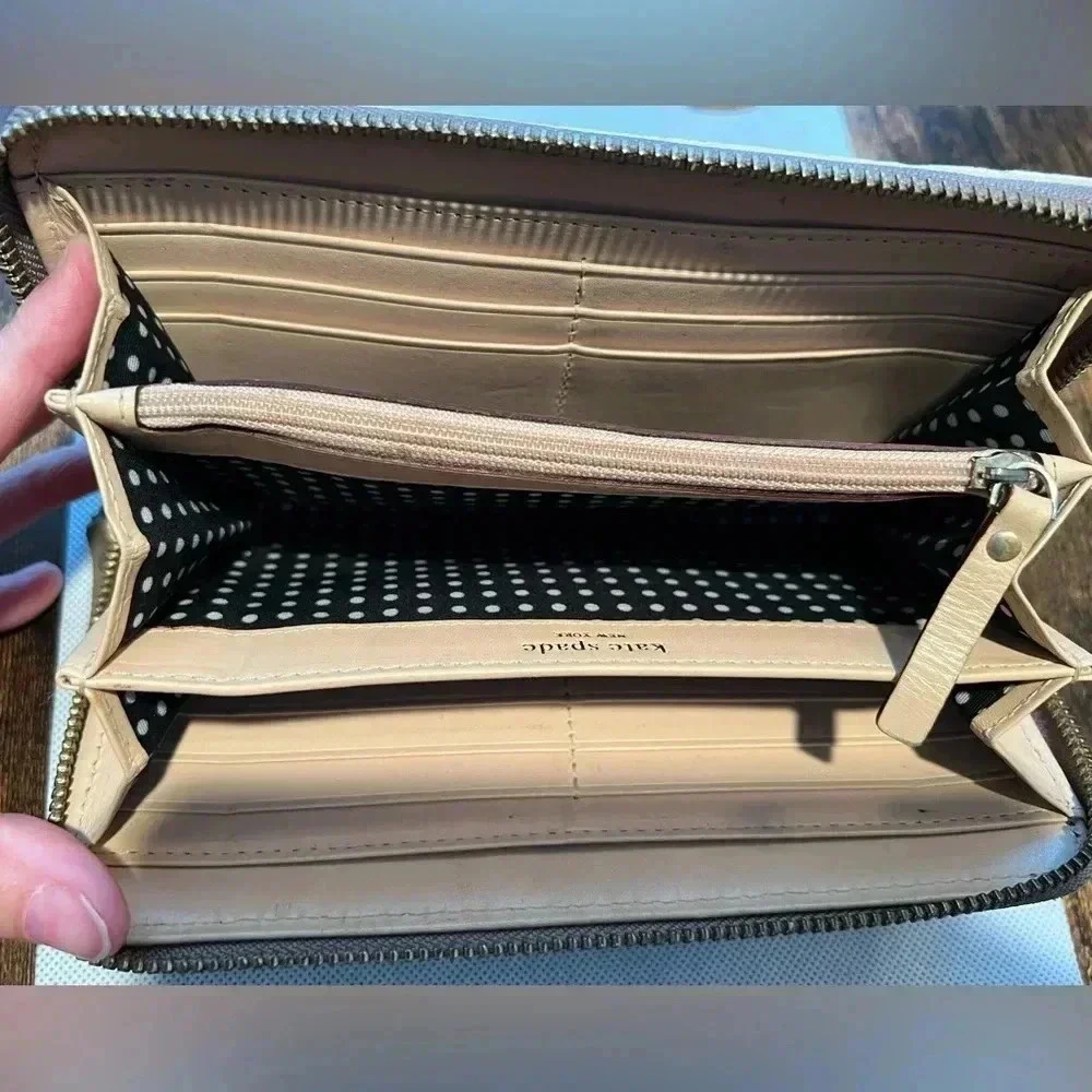 Kate Spade New York| ladies Continental patent leather zip around wallet.